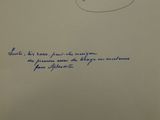an envelope with a handwritten message on it sitting on a table