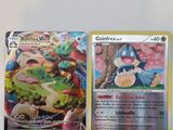 deux cartes pokemon posées l'une sur l'autre sur une table