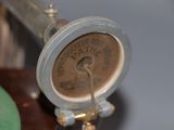 a close up view of a gauge on a table