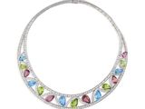 un collier composé de pierres multicolores et de diamants sur fond blanc