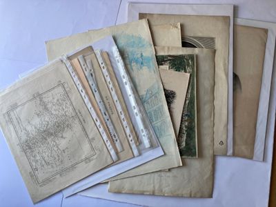 a lot of old papers that are on a table