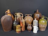 many different types of vases sitting on a table