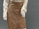 an image of a mannequin wearing a white shirt and brown skirt