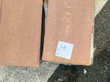 a box of pizza sitting on the ground next to a box of pizza