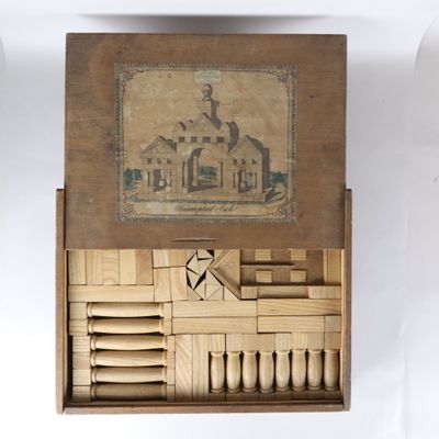 a wooden box with a picture of a building inside of it