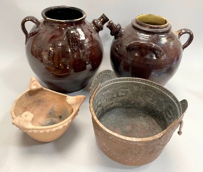 three brown vases sitting next to each other on a white surface