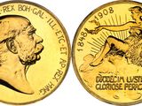 a close up of a gold coin with a man on it