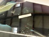 a sticker on the windshield of a car with a name on it