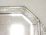 a mirror that has a flower design on it