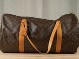 louis vuittou bag on a table with a curtain in the background