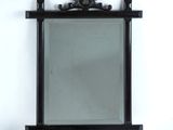 an image of a mirror on a stand against a white wall