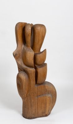 wooden sculpture of a hand holding a bunch of flowers on a white background