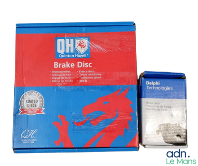 a box of brake discs next to a package of brake discs