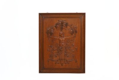 an old wooden plaque with a cross and grapes on it