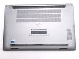a laptop that is sitting on a white surface
