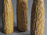 three vases that are sitting on a table