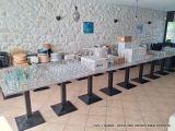 a long table with many glasses on it in a room