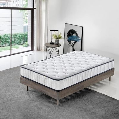 a mattress that is sitting on the floor in a room