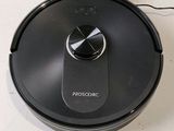 a black robot that is sitting on a counter