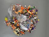a lot of small toy figurines in a plastic bag