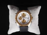 an image of a close up of a watch on a pillow