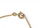 gold plated bracelet with a heart charm on a gold plated chain