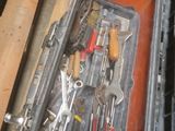 many tools in a tool case on the floor