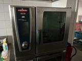 two ovens that are sitting in a kitchen