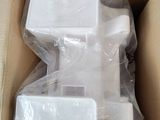 a cardboard box with a toilet and a toilet paper dispenser in it
