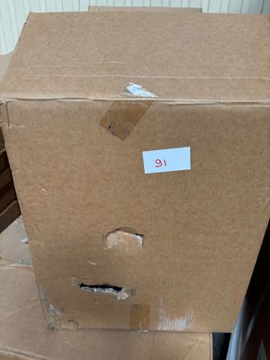 cardboard boxes stacked on top of each other in a room