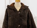 brown faux coat with hood and buttons on a mannequin mannequin mannequin mannequin mannequin mannequin mannequin manne