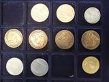 a lot of gold coins in a black box