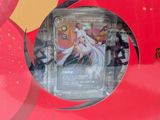 a red box with a picture of a woman in a white dress