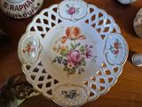 a plate with flowers on it sitting on a table