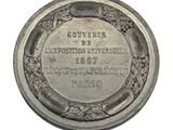 an old silver coin with a picture of a woman on it