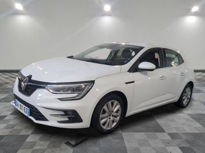 the white car is parked in a large room with a checkered floor