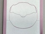 a drawing of a cake on a piece of paper