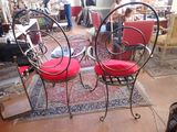two chairs that are sitting on a rug in a room
