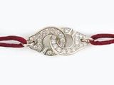 Bracelet « œil maléfique » plaqué argent, avec cordon rouge et cristaux