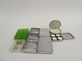 a lot of tins that are sitting on a table