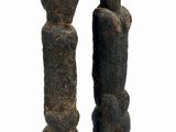 sculpture of two figures on a black base on a white background