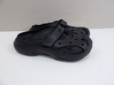 black crocs with a bow on the side of it
