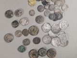 a lot of coins that are on the table