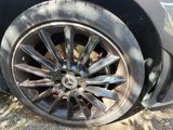 a close up of a car tire on the street