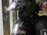 a lot of helmets that are on display in a store