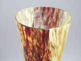 a close up of a vase with a brown and white pattern