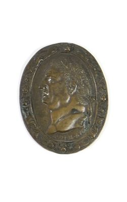 an image of a bronze coin with a woman on it