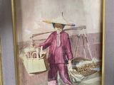 tableau représentant une femme portant un panier de fruits, dans un cadre doré