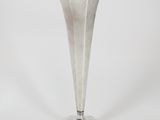 silver plated vase on pedestal on white background with white background