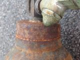 a close up of a propanent with a hose attached to it